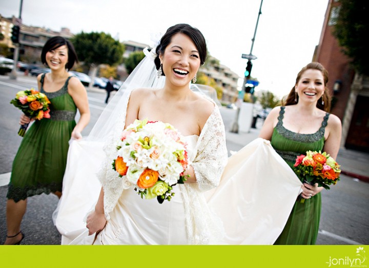 Bride with lace shawl and orange and white flowers Nicole Deanne8