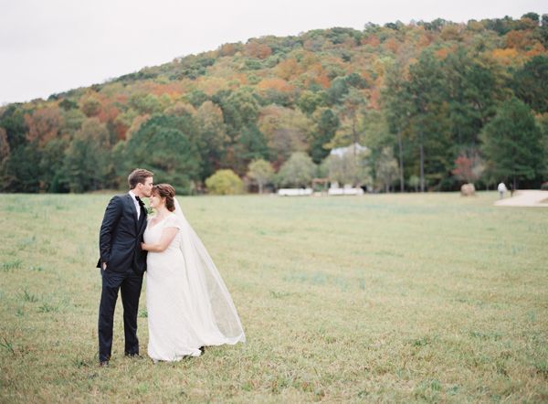 alabama country wedding, bride, groom, long veil, cap sleeved dress, updo, bow tie, tuxedo, scenic, rolling hills, pasture, green