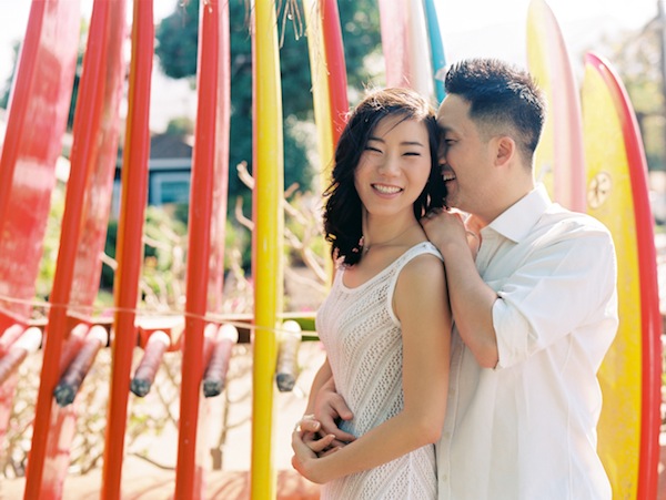hawaiin engagement session, hawaii, couple, love, engaged, beach, ocean, surf, surf boards, kiss, couple
