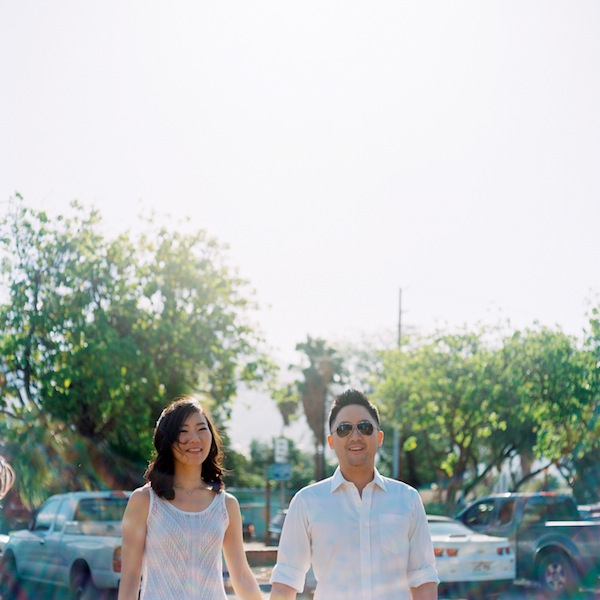 hawaiin engagement session, hawaii, couple, love, engaged, beach, ocean, surf, surf boards, kiss, couple