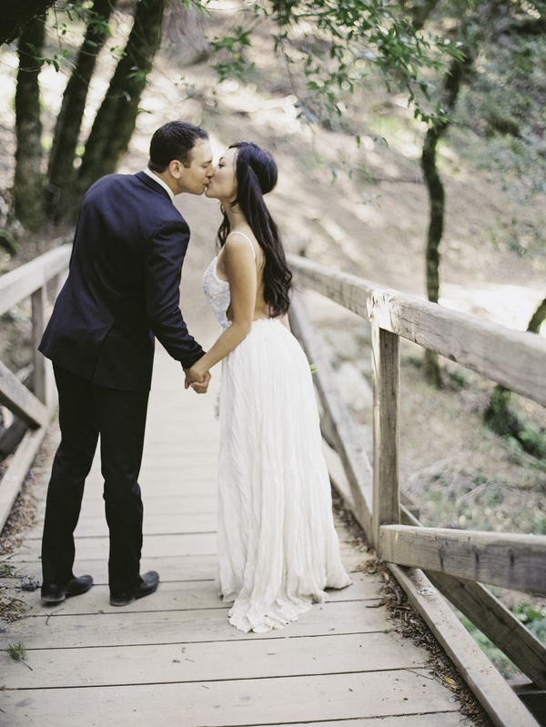 bride,elopement, mountain, floral headband, bohemian, kiss, holding hands